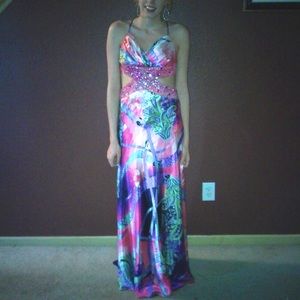 Worn once for senior prom. Beautiful multi color dress with mid drift cut out.